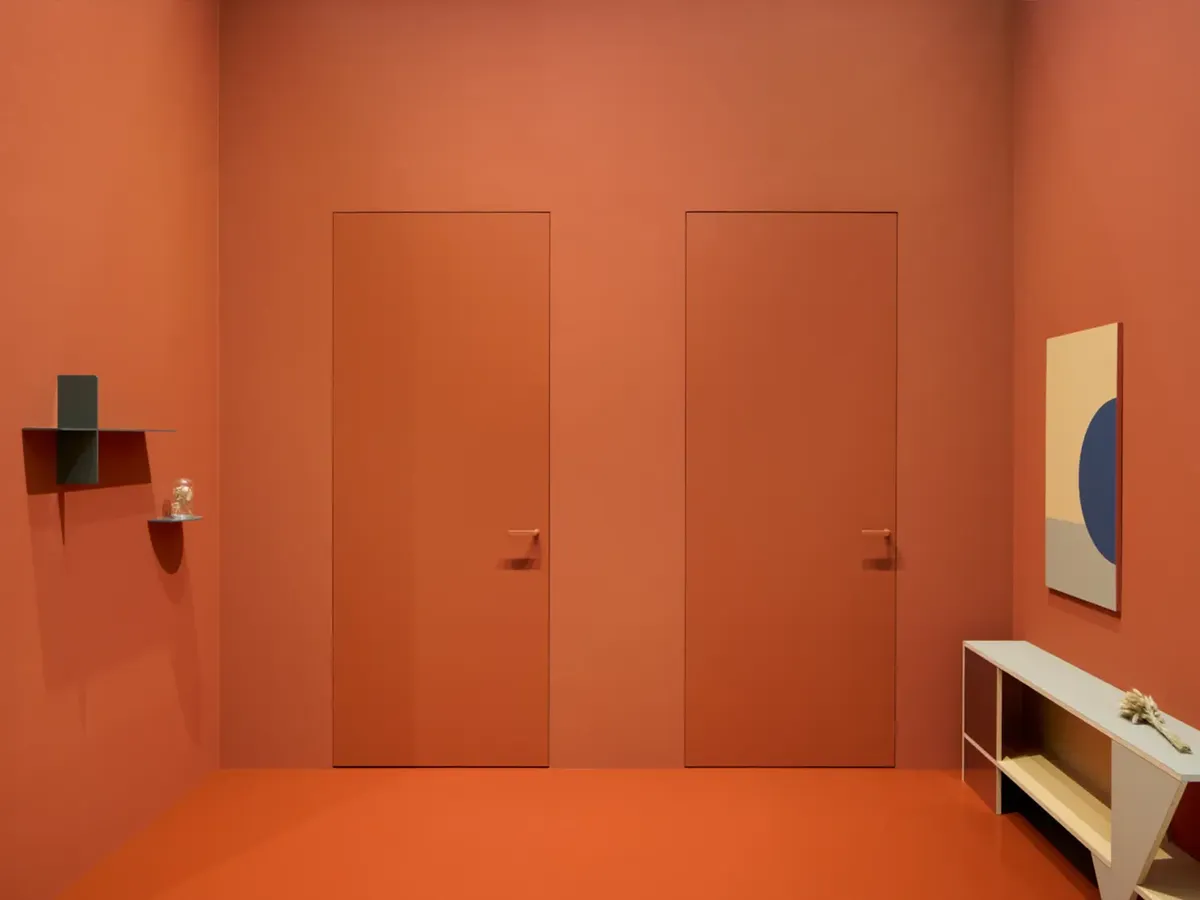 Westag door exhibition at BAU 2025: a monochrome terracotta presentation with flush doors and minimalist furnishings