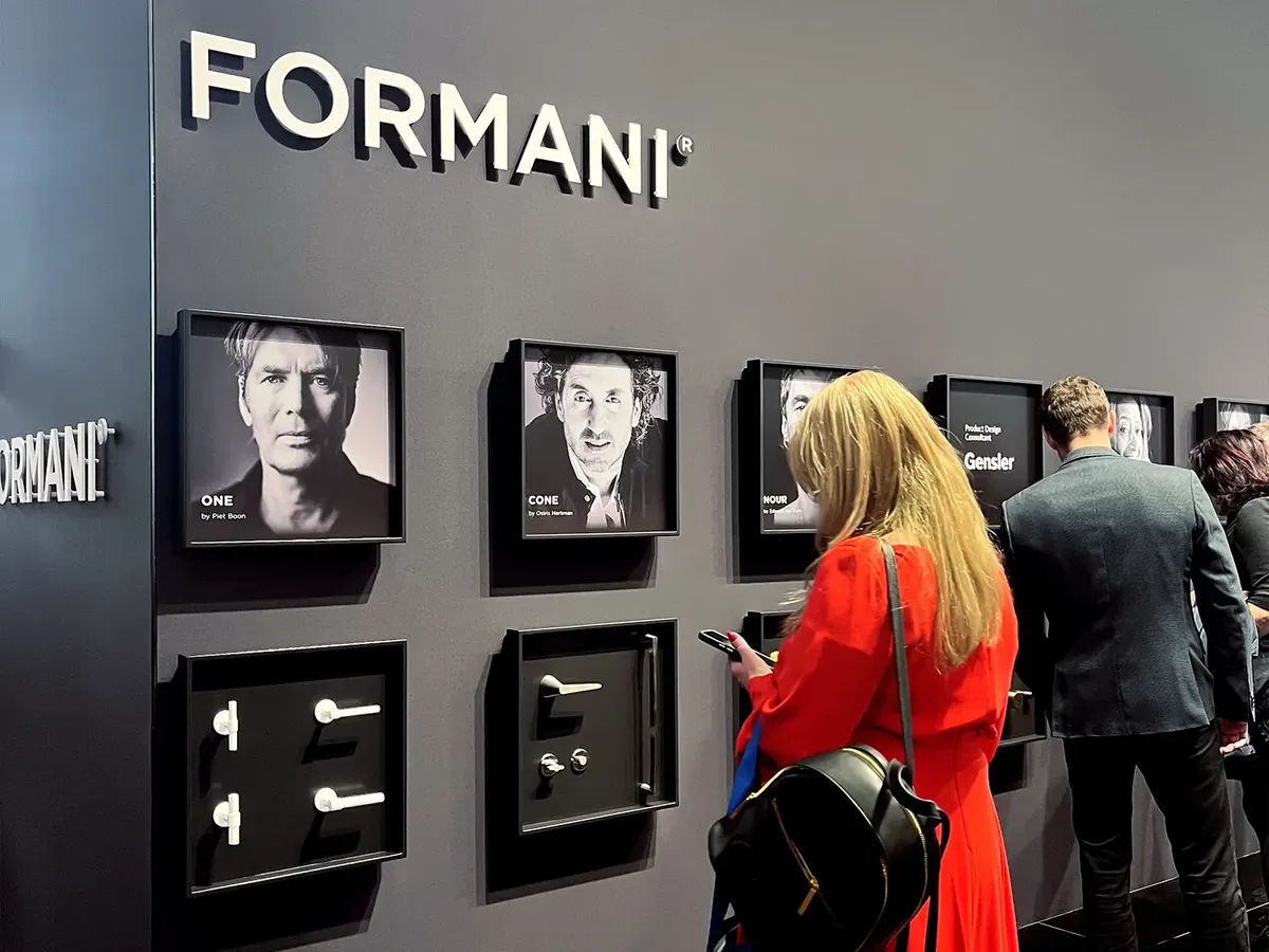 Formani stand divided into black and white with a designer gallery, showing door fittings and handles like artworks on the wall